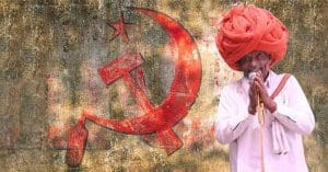 Image of Amra Ram, CPIM candidate, likely celebrating victory in the Sikar elections against BJP's Sumedhanand Saraswati