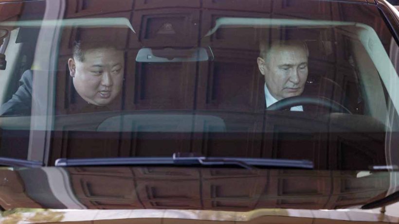 Vladimir Putin and Kim Jong-un drive through Pyongyang in an Aurus limo