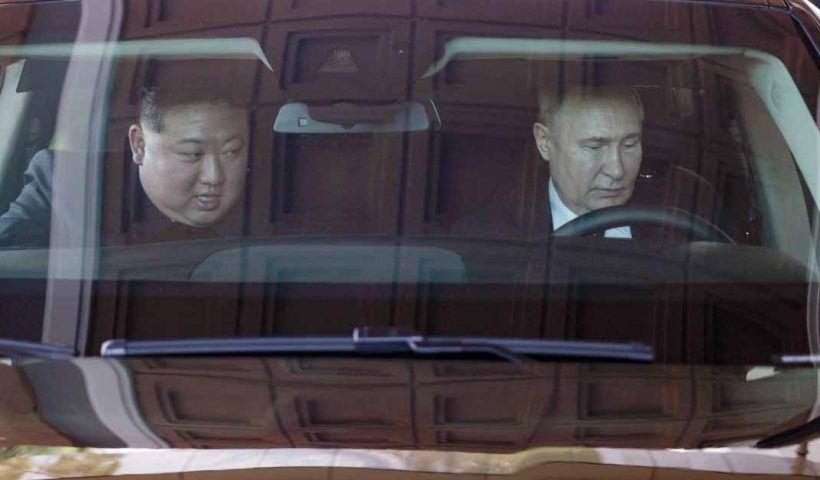 Vladimir Putin and Kim Jong-un drive through Pyongyang in an Aurus limo