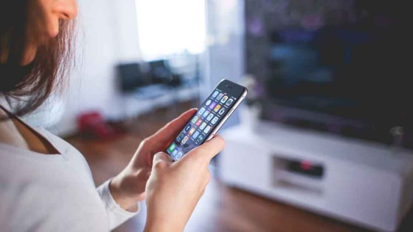 Woman Wearing White V Neck Shirt Using Spac Iphone