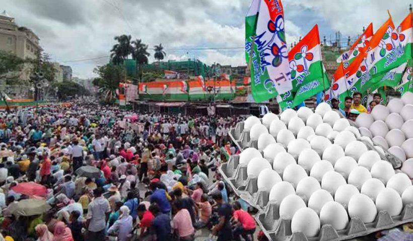 Shaheed Dharamatala Rally: A photo of a large crowd gathered at the Shaheed Dharamatala grounds in Kolkata on 21st July, likely for a political rally or event, with a sea of people and flags visible.