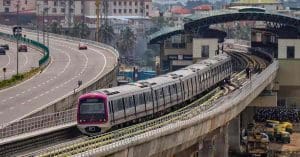 Bengaluru Metro train at a station platform, showcasing modern urban transportation in India.