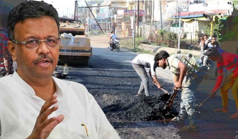 West Bengal Minister Firhad Hakim inspecting road conditions, standing in the middle of a flooded street, surrounded by officials and media personnel, with a serious expression