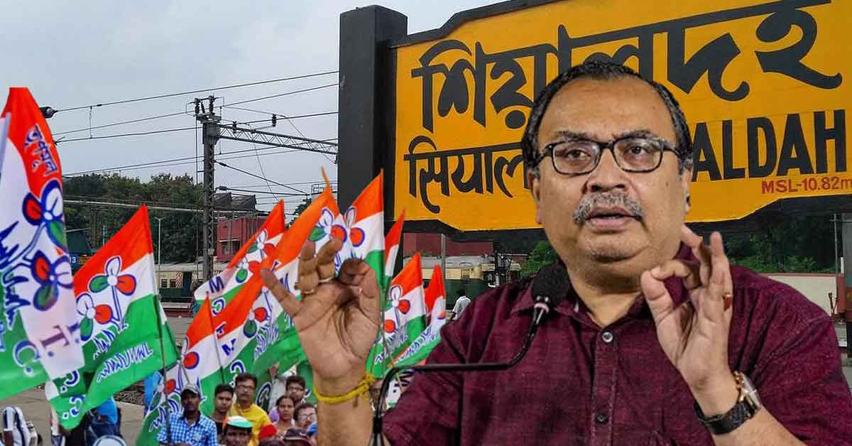 Portrait of Kunal Ghosh, Trinamool Congress leader, with a thoughtful expression, wearing a white shirt and glasses, with a subtle background.