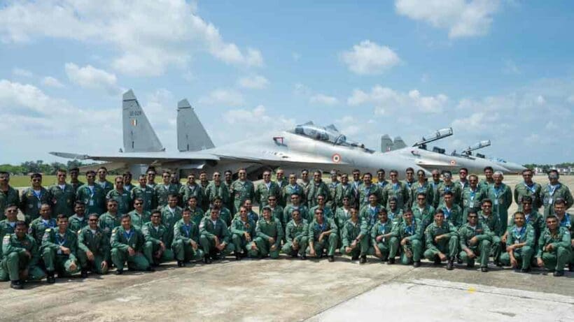 Indian Air Force aircraft in flight against a clear blue sky, showcasing the aircraft’s sleek design and agility.