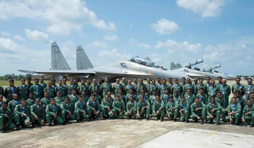 Indian Air Force aircraft in flight against a clear blue sky, showcasing the aircraft’s sleek design and agility.