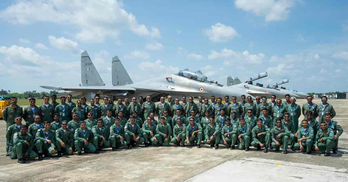 Indian Air Force aircraft in flight against a clear blue sky, showcasing the aircraft’s sleek design and agility.