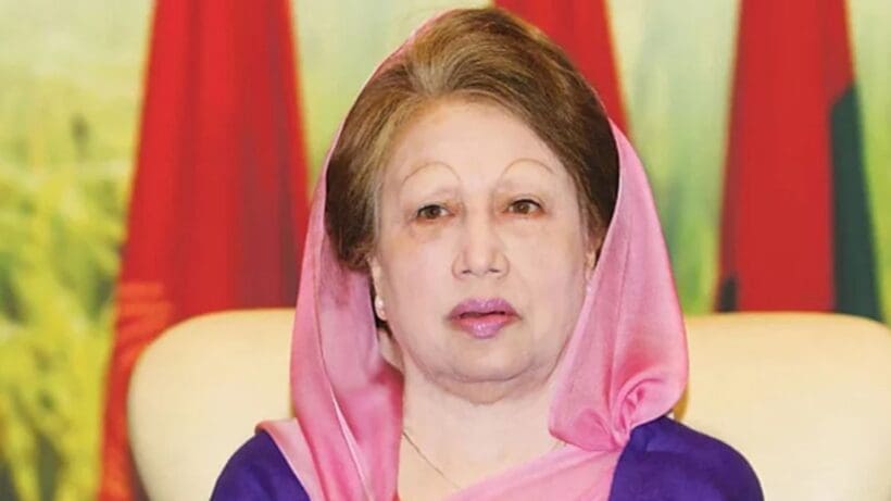 A portrait of Khaleda Zia, a prominent Bangladeshi politician, with a serious expression. She is wearing a traditional outfit and her hair is styled neatly. The background is a neutral color.