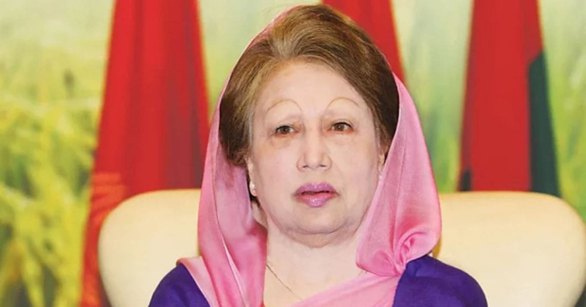 A portrait of Khaleda Zia, a prominent Bangladeshi politician, with a serious expression. She is wearing a traditional outfit and her hair is styled neatly. The background is a neutral color.