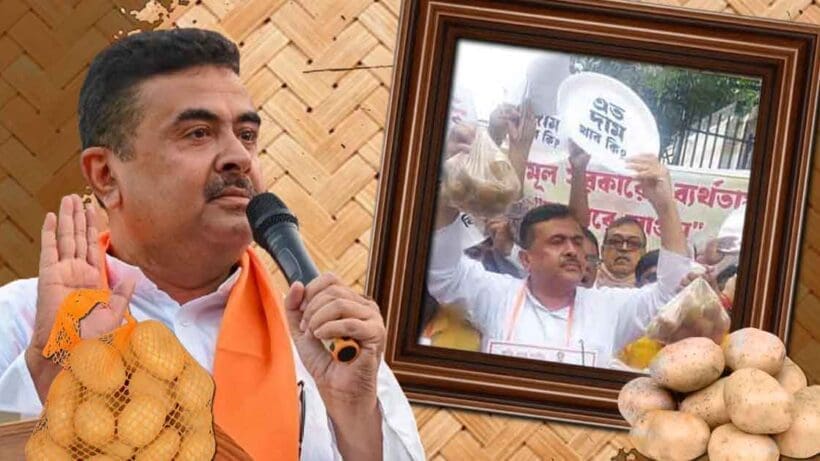 Photo of Suvendu Adhikari, an Indian politician, sitting on a street or road, surrounded by protesters or supporters, holding a placard or sign, engaged in a protest or demonstration, likely related to a social or political issue.