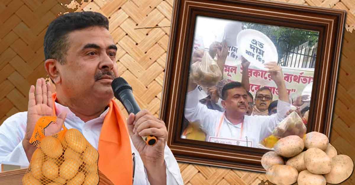 Photo of Suvendu Adhikari, an Indian politician, sitting on a street or road, surrounded by protesters or supporters, holding a placard or sign, engaged in a protest or demonstration, likely related to a social or political issue.