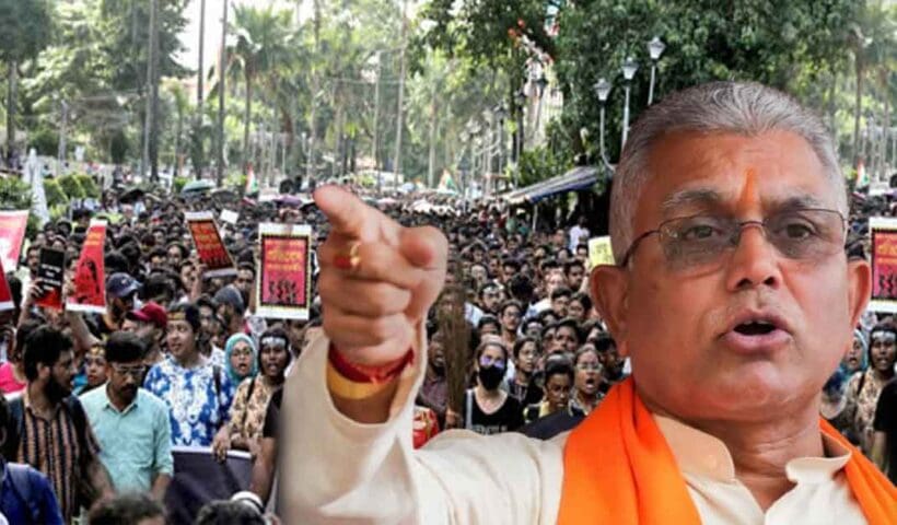 Dilip Ghosh speaking at an event, with a serious expression and gesturing towards the audience.