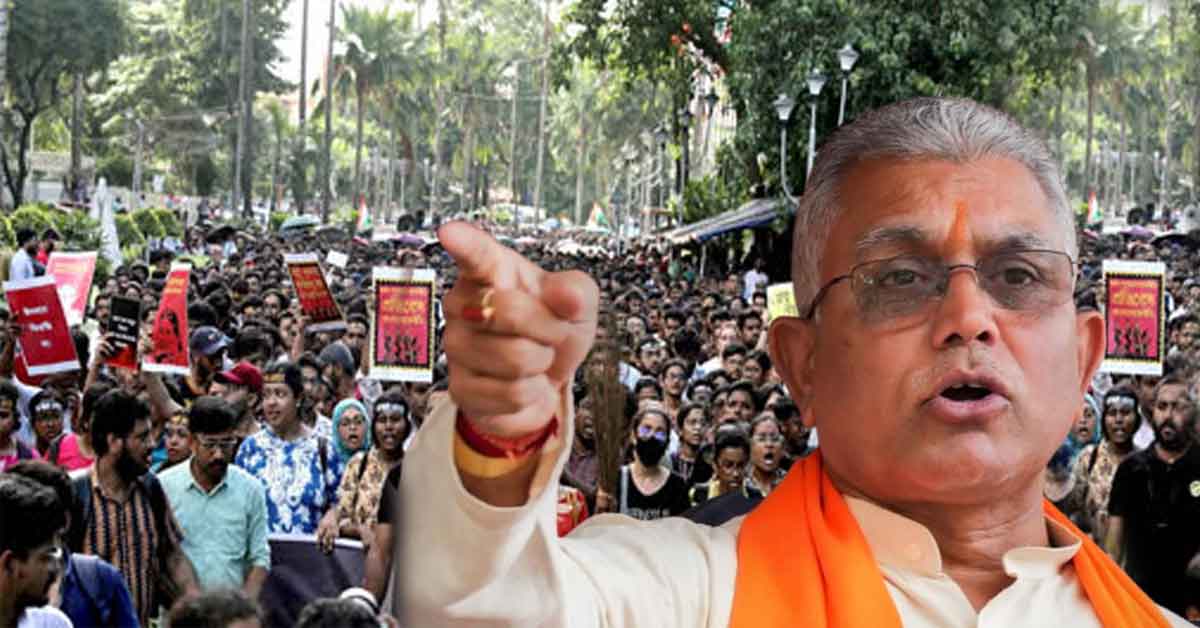 Dilip Ghosh speaking at an event, with a serious expression and gesturing towards the audience.