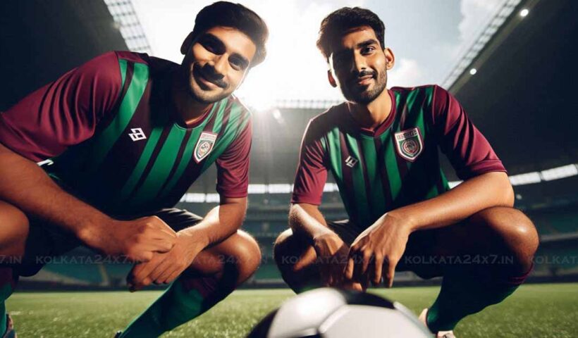 Two ex-footballers of Mohun Bagan, wearing green maroon jerseys, are standing on a football field. The lighting is bright and sunny. They are both holding a football and smiling at the camera. The image is taken from a low angle, making the footballers look tall and powerful.