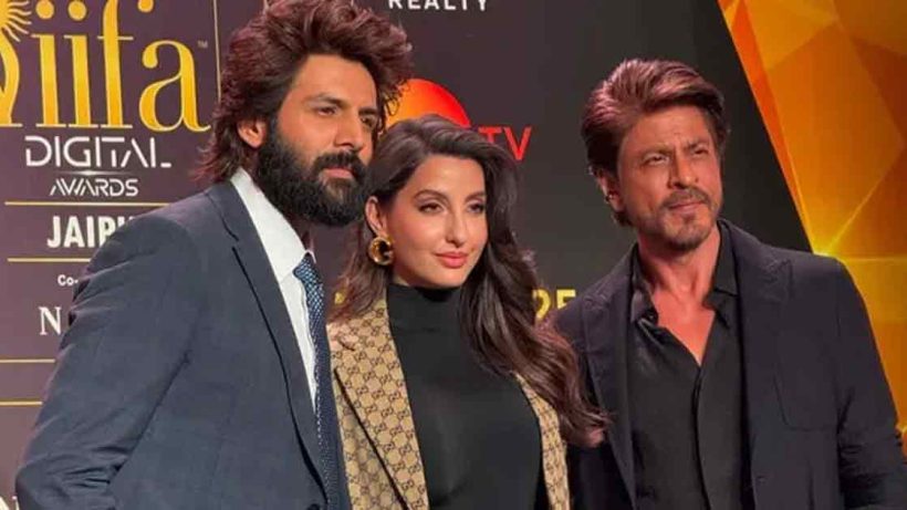 "Shah Rukh Khan shares hosting tips with Kartik Aaryan at the IIFA 2025 pre-event in Mumbai. The duo sets the stage for the upcoming awards with a fun and memorable moment."