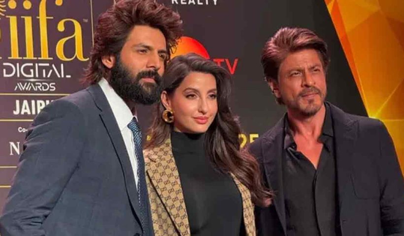 "Shah Rukh Khan shares hosting tips with Kartik Aaryan at the IIFA 2025 pre-event in Mumbai. The duo sets the stage for the upcoming awards with a fun and memorable moment."