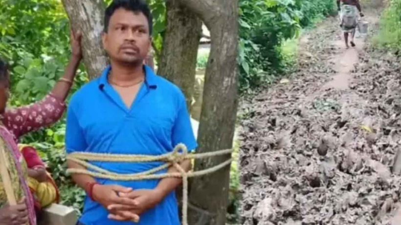 বেহাল রাস্তায় মৃত্যু রোগীর, পঞ্চায়েত সদস্যকে গাছে বেঁধে বিক্ষোভ