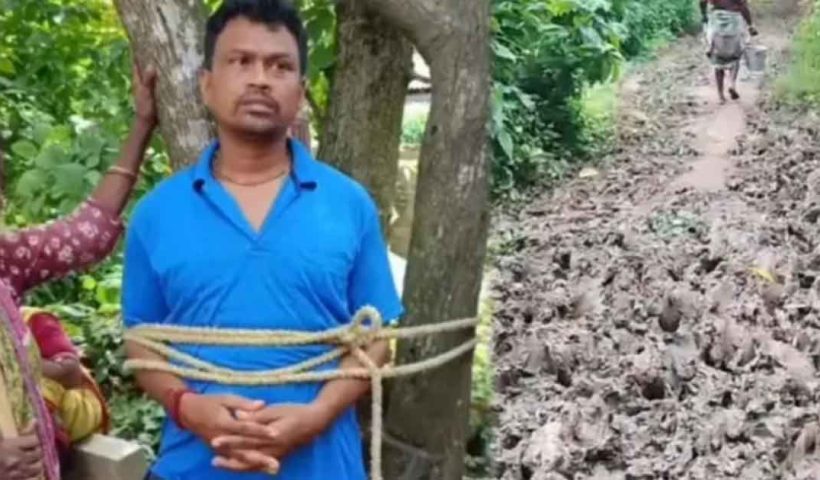 বেহাল রাস্তায় মৃত্যু রোগীর, পঞ্চায়েত সদস্যকে গাছে বেঁধে বিক্ষোভ