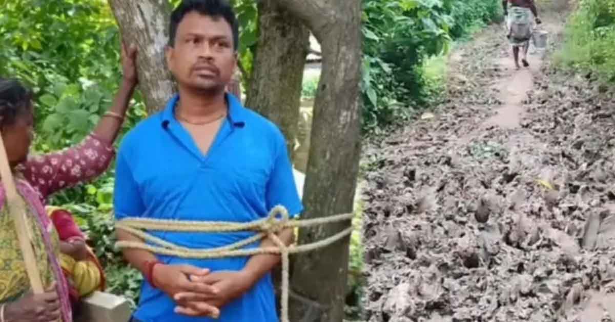 বেহাল রাস্তায় মৃত্যু রোগীর, পঞ্চায়েত সদস্যকে গাছে বেঁধে বিক্ষোভ