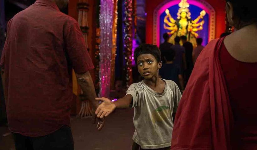 Kolkata Durga Puja 2025 Feature rijus struggle amidst festival joy