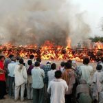 মহিলার মৃতদেহ সৎকারে পুলিশের বাধা, উদ্ধার অর্ধদগ্ধ দেহ!